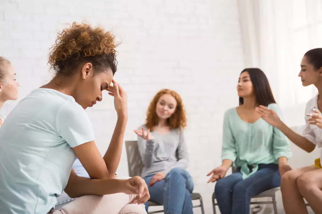 Unhappy African American Woman Sitting On Therapy Session Indoor